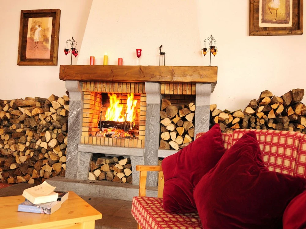 Les chalets des Marmottes - openhaard met blokken hout