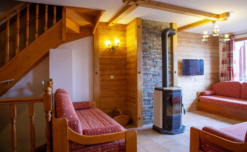 Les Balcons de Val Thorens Spa 8-kamer apt. voor max. 16 pers. woonkamer met openhaard, bank
